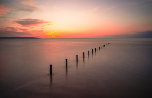 Portstewart Beach Posts at Sunset.